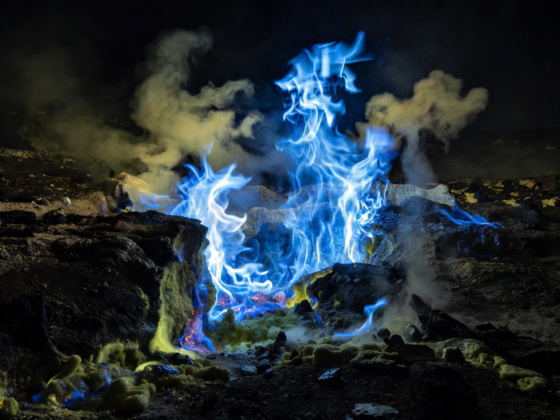 Electric blue flames emitting from sulfuric volcanic vent at Kawah Ijen crater